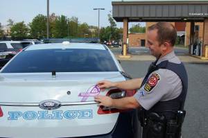 Officers across the agency are placing purple ribbons on their cruisers this month.