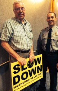  Lt. Jason Long helped distribute neighborhood signs.