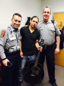 Fellow officer, PFC Roger Henriquez, learned how to play guitar with guidance from Officer Richards and "Elvis."