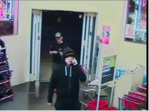 Suspect is wearing dark hood/cap.