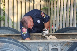 Dan inspecting brake lines