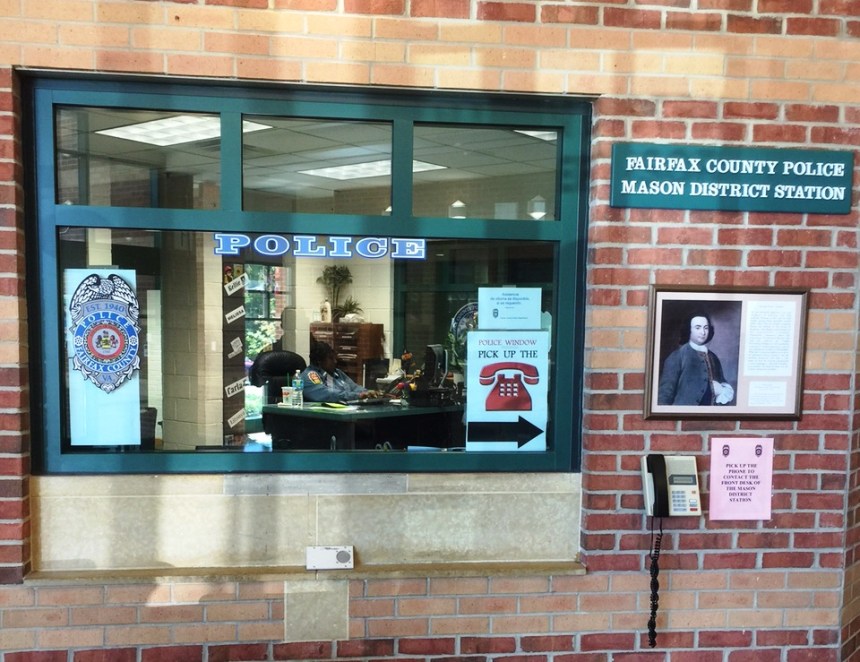 The PCA working at the front desk of the Mason District Station